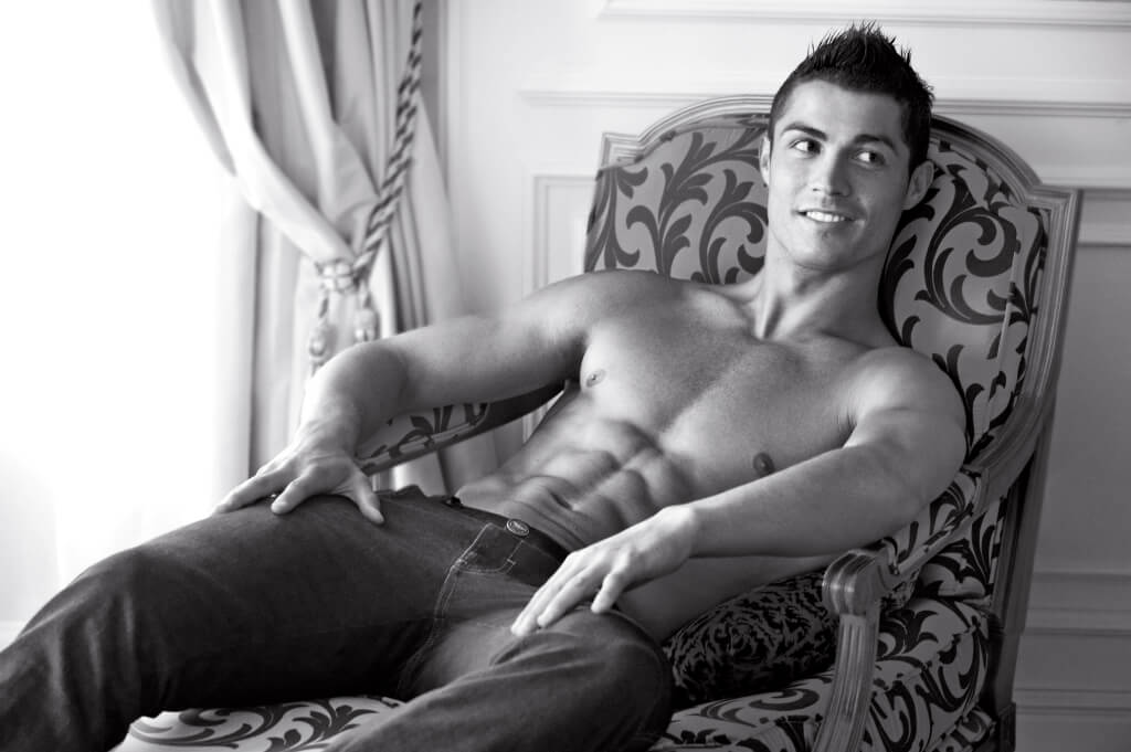 Cristiano chilling at Mr Armani's place. (But tensing his abs.)